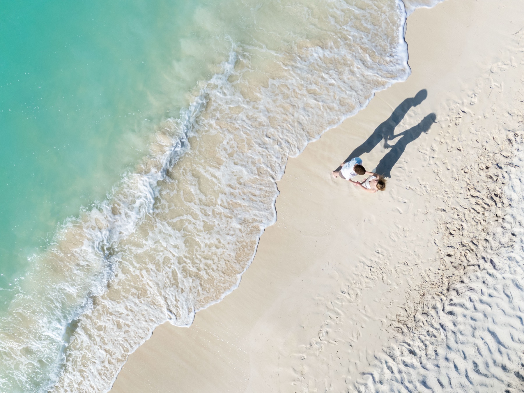 Couples beach portrait in Turks and Caicos by Paradise Photography