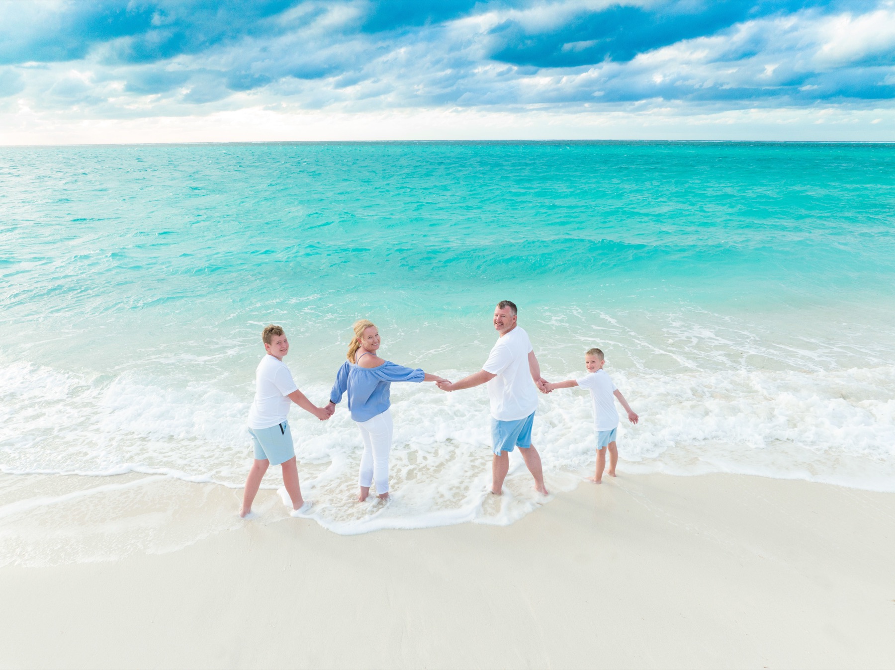 Family beach portrait in Turks and Caicos by Paradise Photography