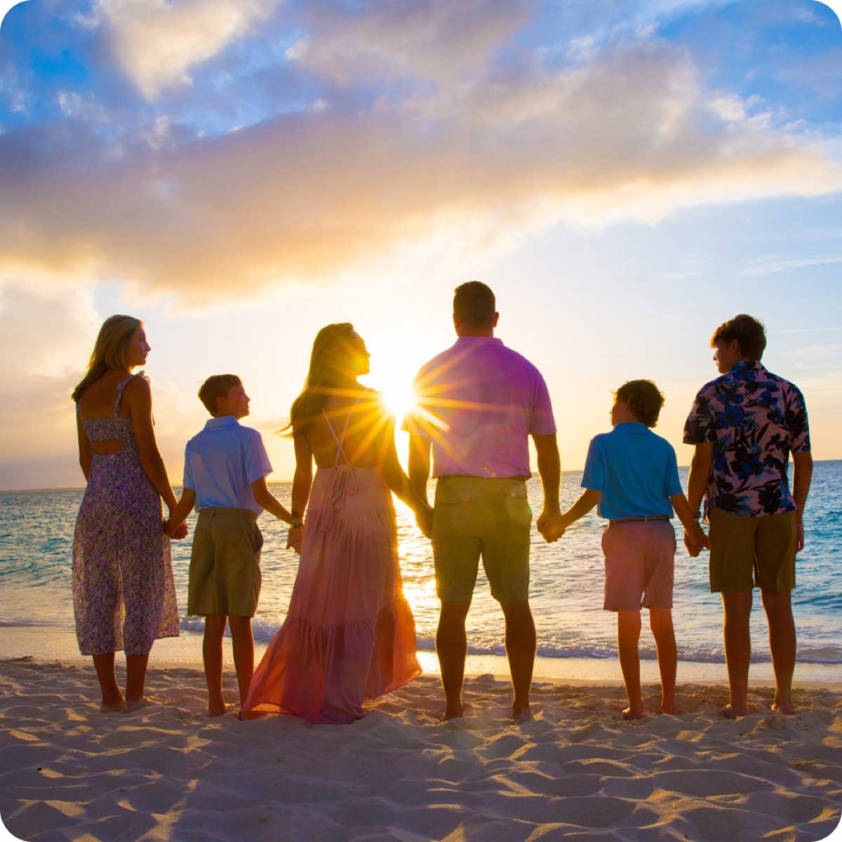 Family at sunset on a Turks and Caicos beach