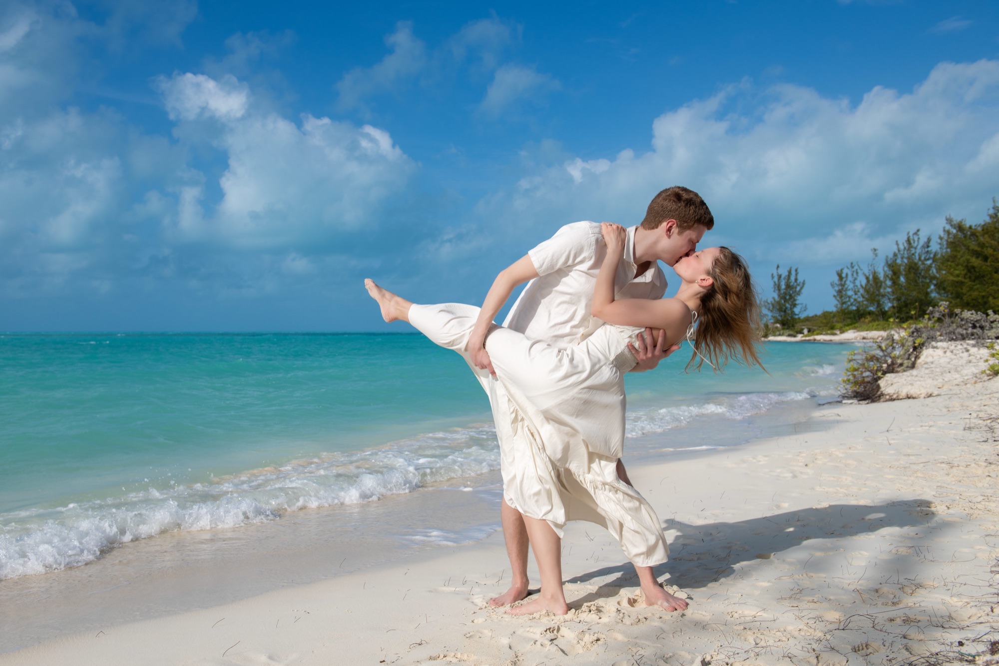 Surprise proposal at sunset on a Turks and Caicos beach